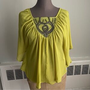 Charlotte Russe butterfly sleeved blouse with beaded square neckline.